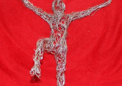 metaphor-steel-wire-man-arms-up